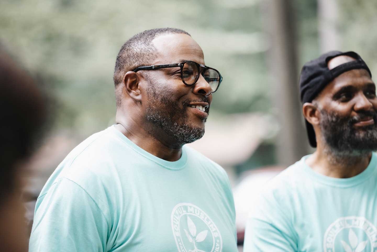 A smiling volunteer focusing during a meeting